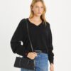 Bolso pequeño East-West con T Monogram en relieve