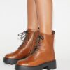 Botas con suela gruesa y T Monogram Botas con suela gruesa y T Monogram