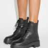 Botas con suela gruesa y T Monogram Botas con suela gruesa y T Monogram