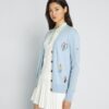 Cardigan de golf bordado de cachemira Cardigan de golf bordado de cachemira