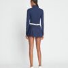 Falda plisada con superposición de jersey jacquard de alto rendimiento Falda plisada con superposición de jersey jacquard de alto rendimiento