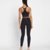 Leggings con bolsillos laterales y compresión moldeadora Leggings con bolsillos laterales y compresión moldeadora