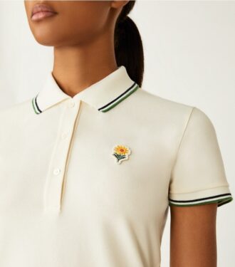 Polo de piqué con flores de alto rendimiento Polo de piqué con flores de alto rendimiento