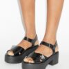 Sandalias con tacón de plataforma y cierre giratorio Sandalias con tacón de plataforma y cierre giratorio