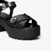 Sandalias con tacón de plataforma y cierre giratorio Sandalias con tacón de plataforma y cierre giratorio