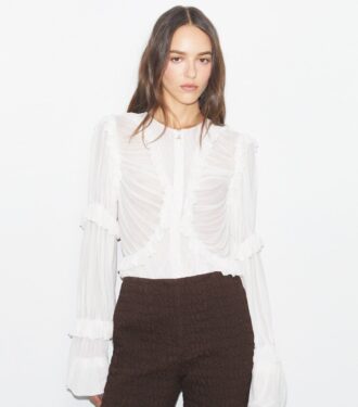 Top de jersey transparente con volantes